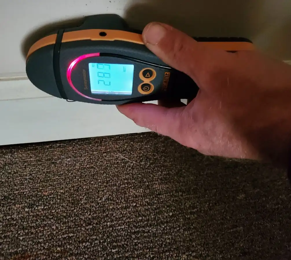 Moisture detection at baseboard during Storm Damage Restoration in Andover